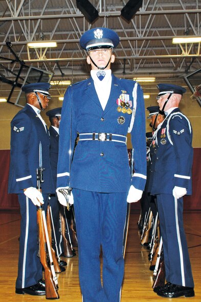 1st Lt. Chad Frey from the Air Force Honor Guard Drill Team stands after marching through a narrow gauntlet of spinning rifles.  (U.S. Air Force photo/Staff Sgt. Steve Nabor)
