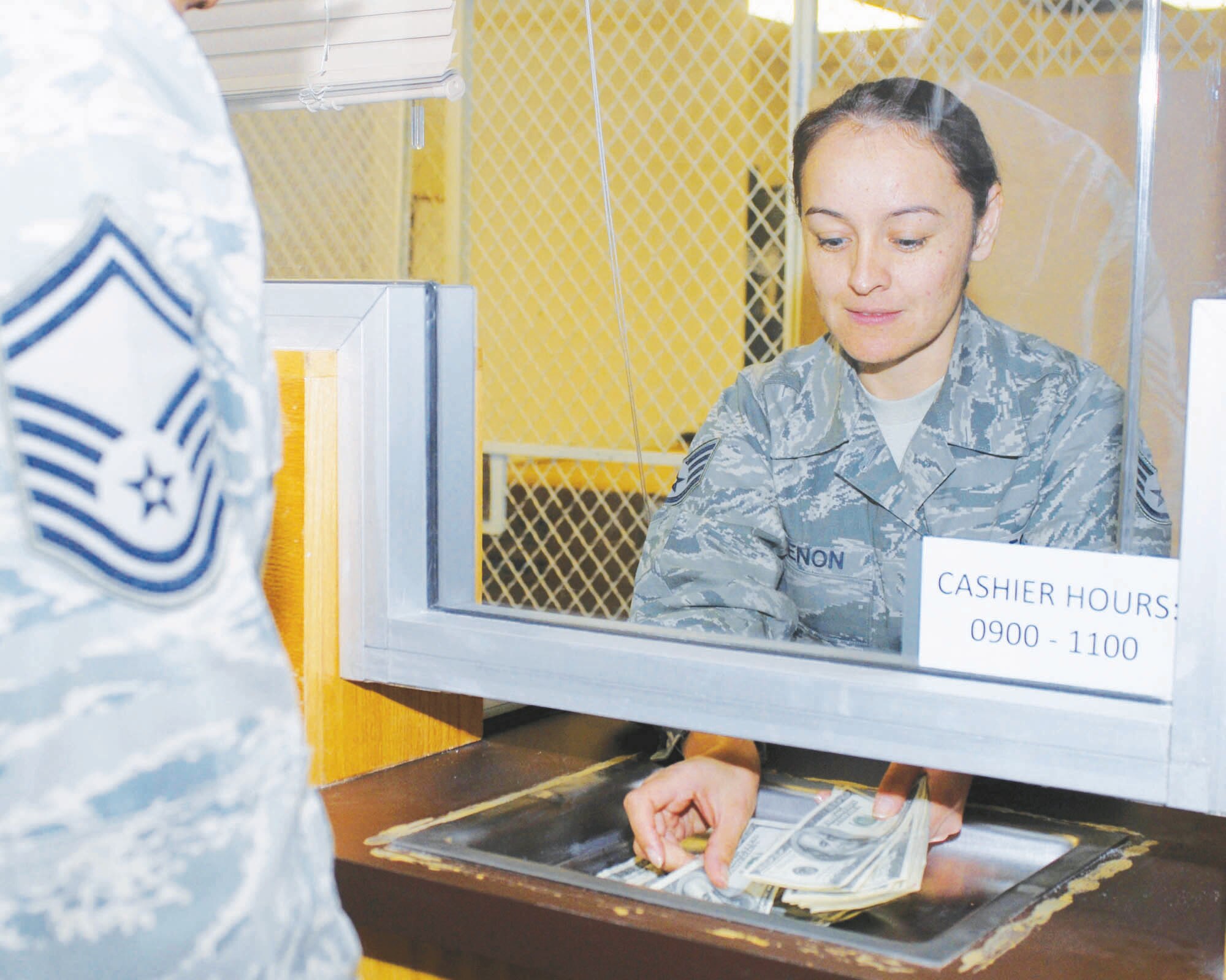 Staff Sgt. Zully Birkbeck, 56th Comptroller Squadron financial management analyst, helps a senior NCO at the customer service center.  Sergeant Birkbeck was recently named as one fo the 12 Outstanding Airmen of the Year for 2010.  (Courtesy photo)