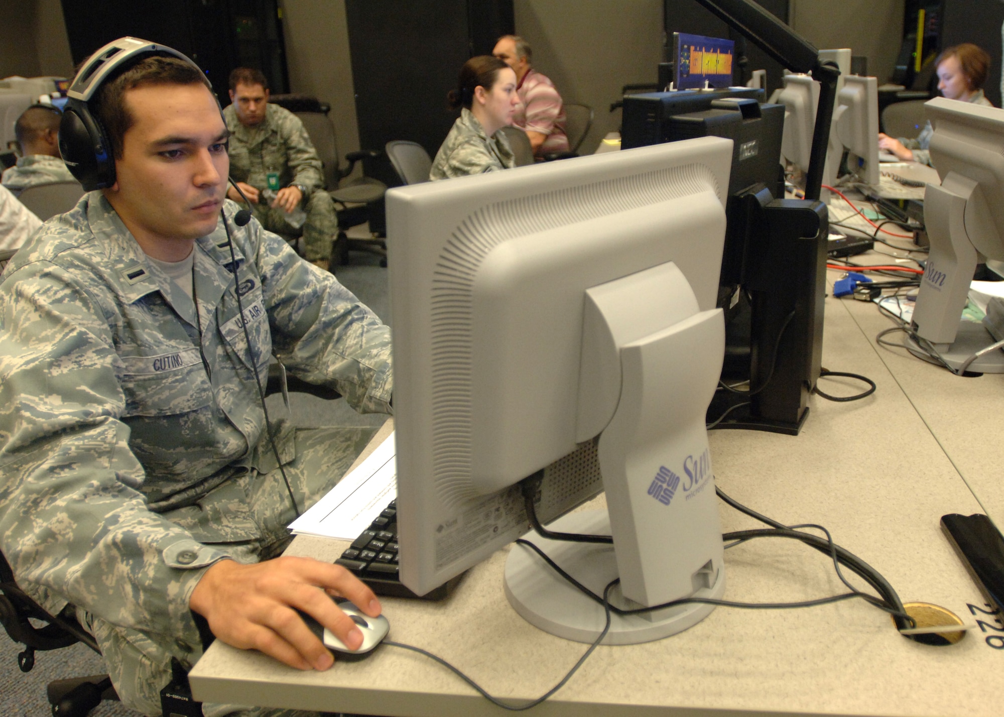 LANGLEY AIR FORCE BASE, Va. -- 1st Lt. Josh Cutino, 30th Intelligence Squadron mission operations commander, tracks data provided by reconnaissance aircraft August 12 during Empire Challenge 10 at the Ryan Center.  The EC10 exercise was an annual Joint and Coalition ISR interoperability demonstration which pulled resources worldwide to showcase emerging ISR capabilities and provide vital lessons learned to improve support to warfighters at the tactical level. (U.S. Air Force Photo/Tech Sgt Randy Redman)
