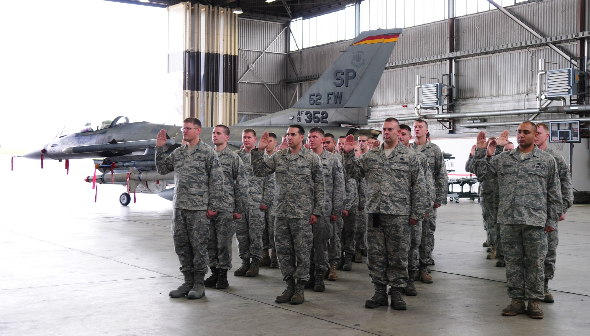 SPANGDAHLEM AIR BASE, Germany -- Twenty-nine F-16 Fighting Falcon crew chiefs take their professional oath during a ceremony recognizing each of their assignments to specific aircraft in the 480th Fighter Squadron fleet Aug 13. The Dedicated Crew Chief Ceremony is meant to recognize crew chiefs for their hard work and dedication to ensuring aircraft are properly maintained and mission-ready. (U.S. Air Force Photo by/Staff Sgt. Heather M. Norris)