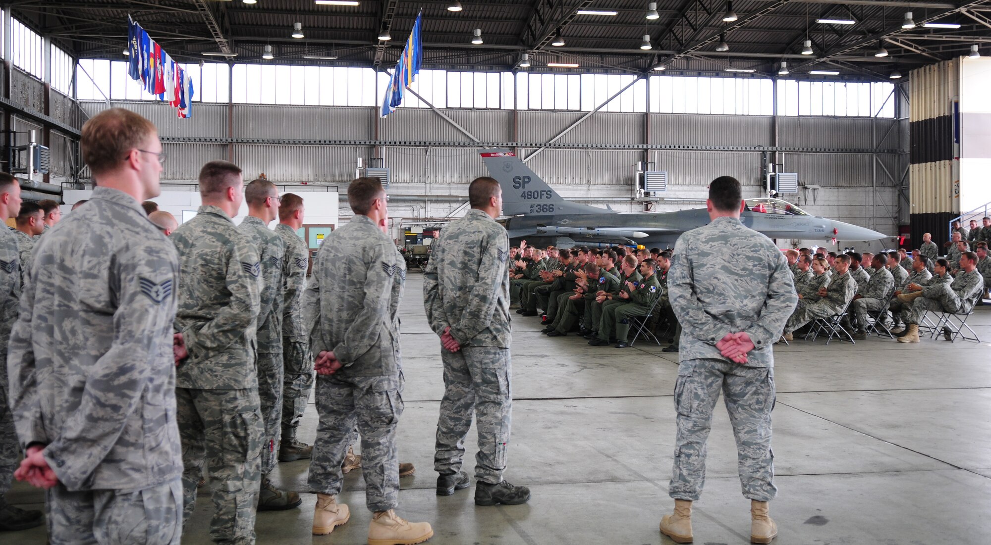 SPANGDAHLEM AIR BASE, Germany -- Twenty-nine F-16 Fighting Falcon crew chiefs stand in formation during a ceremony recognizing each of their assignments to specific aircraft in the 480th Fighter Squadron fleet Aug 13. These individuals were awarded the honor of dedicated crew chief for demonstrating superior performance in compliance with safety practices and technical requirements while displaying managerial skills and leadership abilities.  (U.S. Air Force Photo by/Staff Sgt. Heather M. Norris)