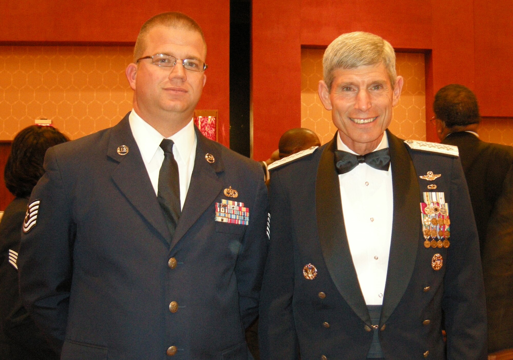 Tech. Sgt. William McDonald poses with Air Force Chief of Staff Gen. Norton Schwartz July 29 during festivities at the 39th Annual Tuskegee Airmen National Convention in San Antonio. Eight Airmen from the Air Force Reserve's 302nd Airlift Wing attended the event, hearing from senior military leaders on topics including mentoring, women in the military and financial management as well as training on leadership and development. The 302nd AW members also took part in sit-down conversations with surviving members of the famed Tuskegee Airmen "Red Tails" as they described their experiences from World War II and the military in general to the AF Reservists. The conference attendance was part of a series of career broadening events sponsored by the 302nd AW's Human Resources Development Council. (Courtesy photo)