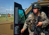 MINOT AIR FORCE BASE, N.D. -- Staff Sgt. Ryan Pfeifer, 791st Missile Security Forces Squadron convoy response force leader, participates in a recovery and recapture exercise during a convoy training mission here Aug. 12. (U.S. Air Force photo by Senior Airman Benjamin Stratton)