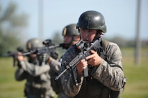 MINOT AIR FORCE BASE, N.D. -- Staff Sgt. Ryan Pfeifer, 791st Missile Security Forces Squadron convoy response force leader, diligently moves toward a simulated missile site during a convoy training mission here Aug. 12. Sergent Pfeifer was recently named one of the Air Force’s 12 Outstanding Airmen of the year. (U.S. Air Force photo by Tech. Sgt. Lee A. Osberry Jr.)