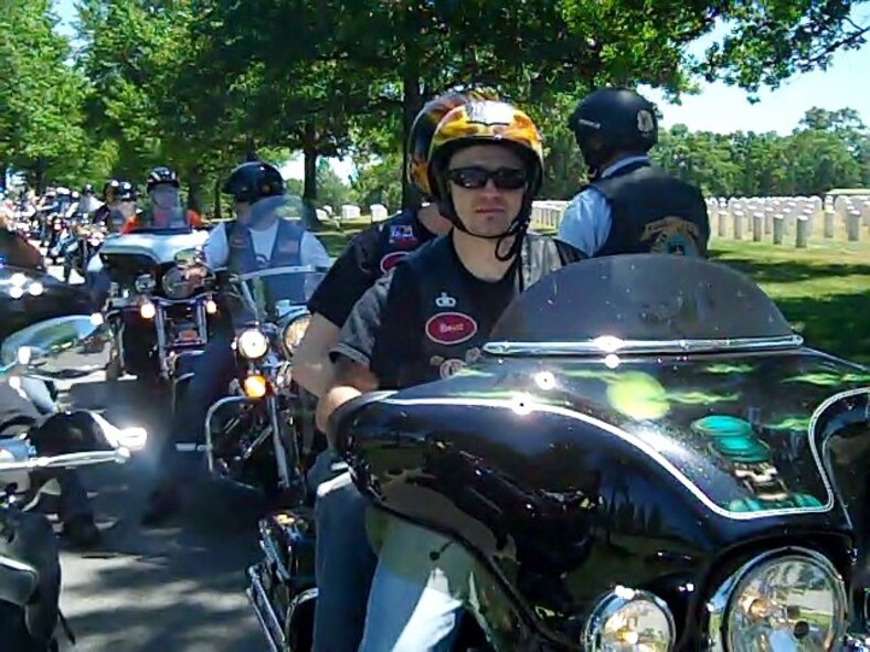 Senior Master Sgt. Jim Loper, 916 ARW/CP, awaits further instruction as part of the motorcycle procession escorting the remains of Senior Master Sgt. (retired) Ronald Jansen through Arlington National Cemetery, Arlington, VA. (USAF photo by MSgt. Wendy Lopedote, 916ARW/PA)