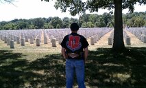 Senior Master Sgt. Jim Loper, 916 ARW/CP, pauses to reflect on the sacrifice made by fellow military members at Arlington National Cemetery, Arlington, VA. (Photo courtesy of SMSgt. Jim Loper, 916 ARW/CP)