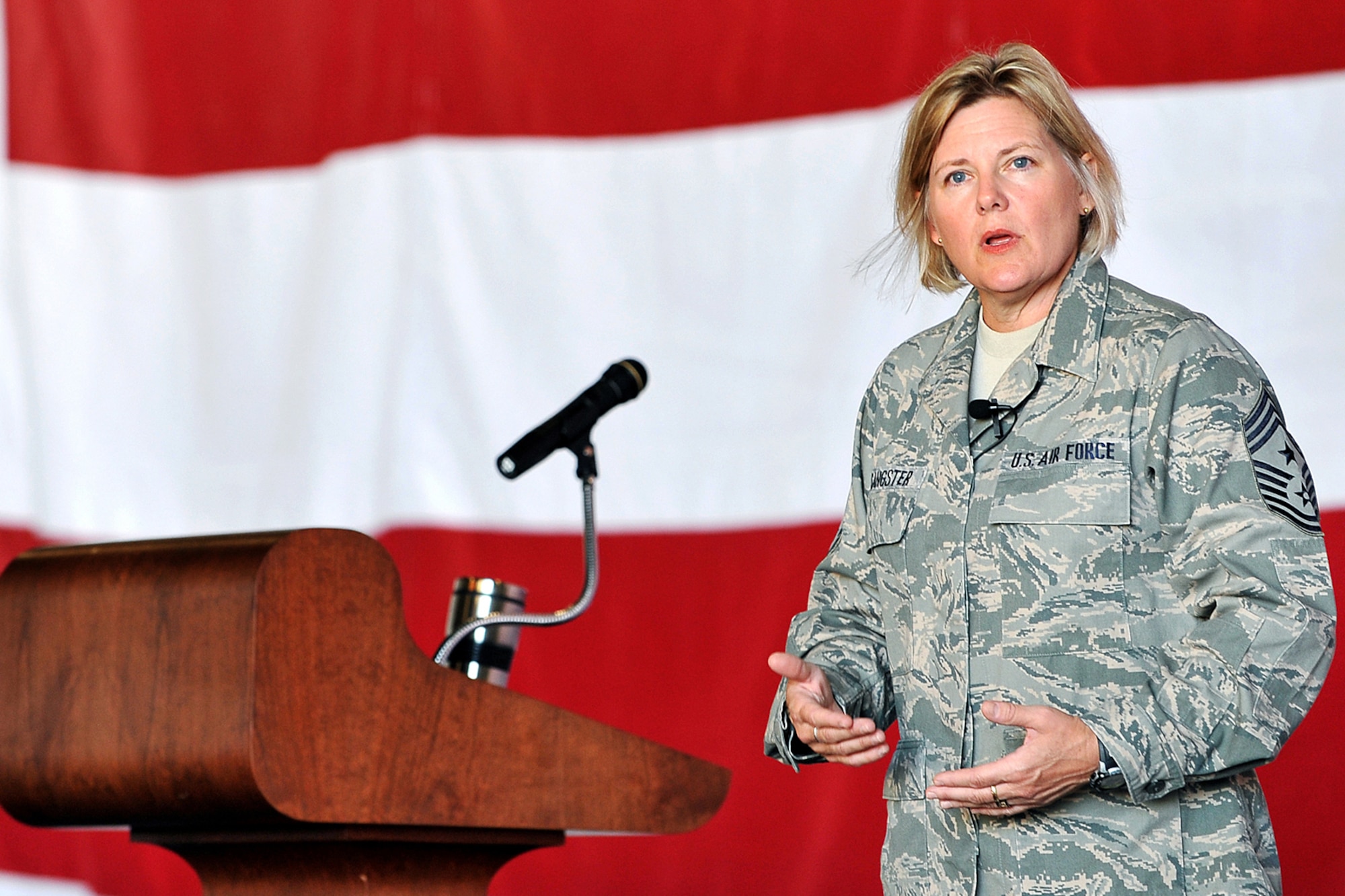 OFFUTT AIR FORCE BASE, Neb. - New 55th Wing Command Chief Master Sgt. Suzan Sangster talks to Team Offutt enlisted members during her first enlisted call here Aug. 11 inside the Bennie Davis Maintenance Facility. During the event, she emphasized such things as team work and drinking responsibly. U.S. Air Force photo by Charles Haymond