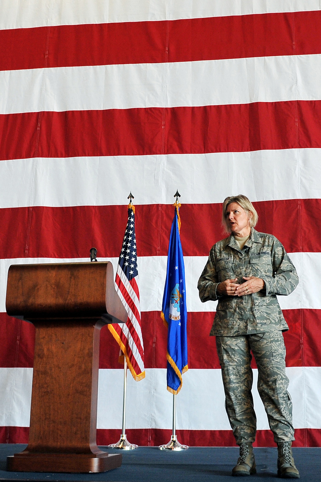 OFFUTT AIR FORCE BASE, Neb. - New 55th Wing Command Chief Master Sgt. Suzan Sangster talks to Team Offutt enlisted members during her first enlisted call here Aug. 11 inside the Bennie Davis Maintenance Facility. During the event, she emphasized such things as team work and drinking responsibly. U.S. Air Force photo by Charles Haymond