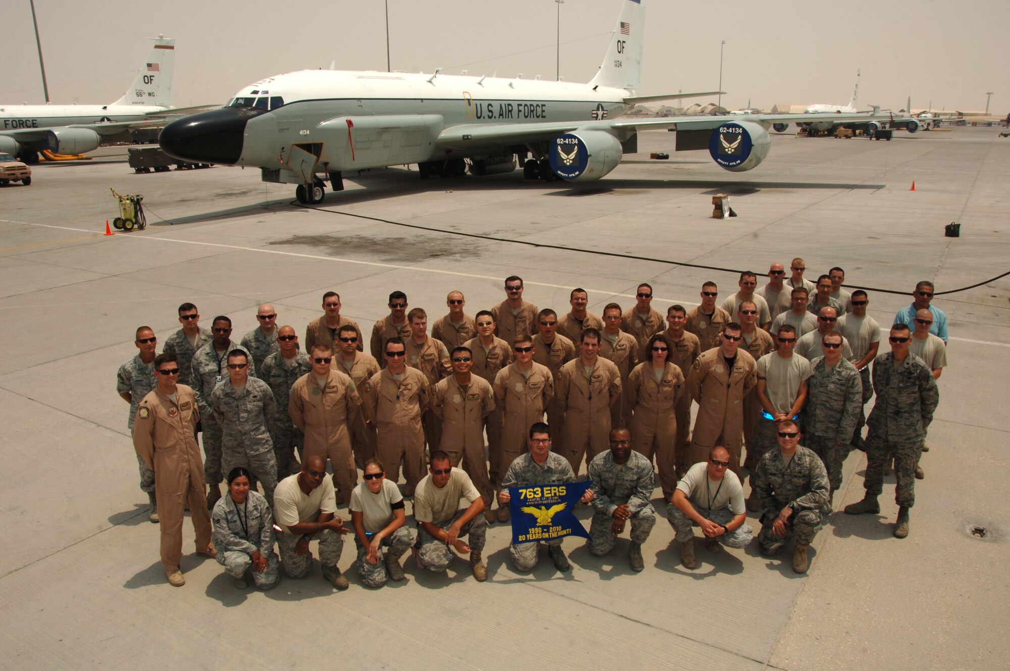 SOUTHWEST ASIA -- Members of the 763rd Expeditionary Reconnaissance Squadron and 379th Expeditionary Aircraft Maintenance Squadron pose in front of a RC-135 V/W Rivet Joint aircraft at an undisclosed location Aug. 9, 2010, after completing a mission. This mission marked 20 years of continuous operation in the U.S. Central Command's area of responsibility for the aircraft from Offutt Air Force Base, Neb. (U.S. Air Force photo/Tech. Sgt. Kimberly Spinner) RELEASED