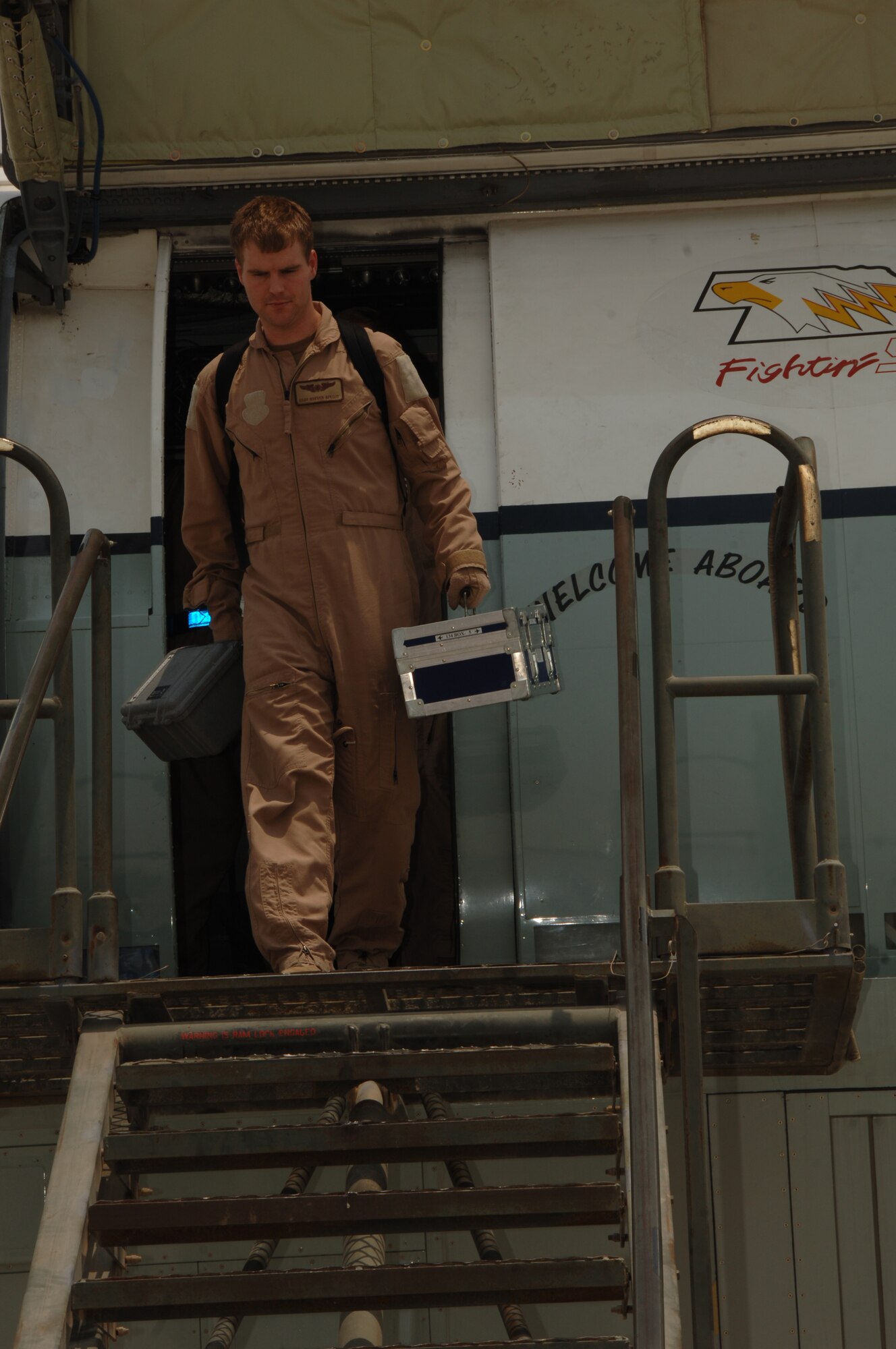 SOUTHWEST ASIA -- Staff Sgt. Steven Specht, 763rd Expeditionary Reconnaissance Squadron, departs a RC-135 V/W Rivet Joint aircraft at an undisclosed location Aug. 9, 2010, after completing a mission. This mission marked 20 years of continuous operation in the U.S. Central Command's area of responsibility for the aircraft from Offutt Air Force Base, Neb. (U.S. Air Force photo/Tech. Sgt. Kimberly Spinner) RELEASED