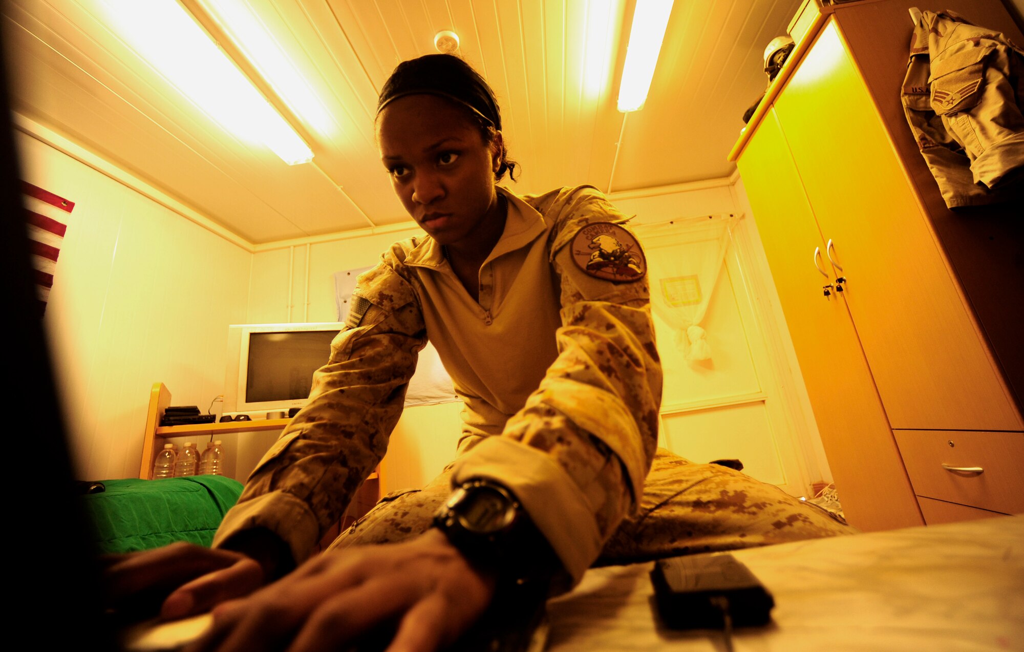 U.S. Air Force Senior Airman Asha McMakin, a combat photographer assigned to the 1st Combat Camera Squadron, goes through final edits on her imagery prior to handing the photos over the the Army Civil Affairs team at Ramadi, Iraq on Aug. 2, 2010. SrA McMakin is attached to an Army Civil Affairs team while deployed in support of Operation Iraqi Freedom.
(U.S. Air Force photo by Staff Sgt. Andy M. Kin / Released)