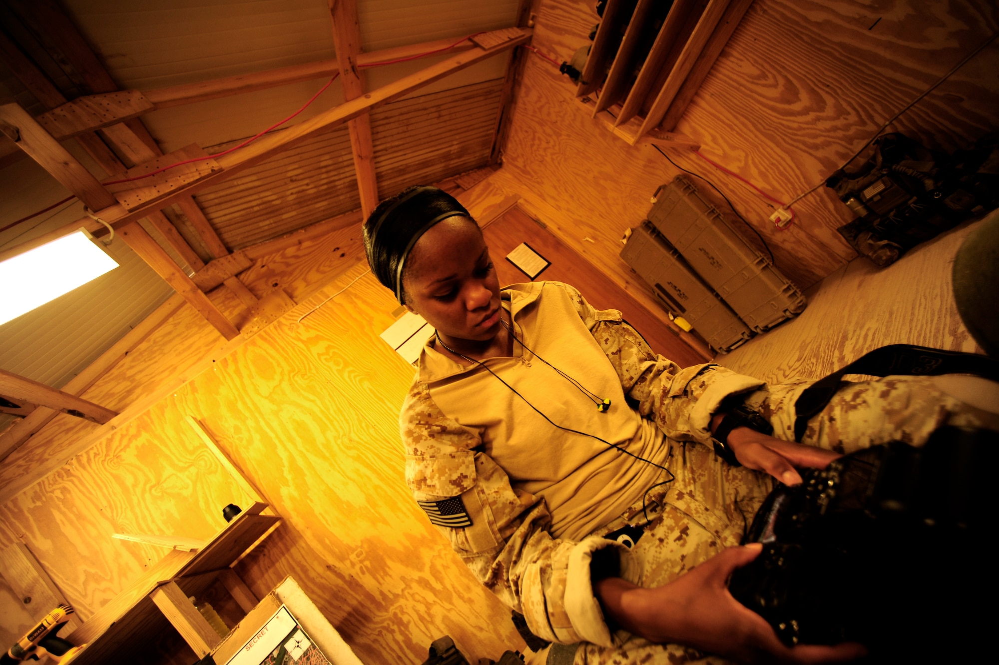U.S. Air Force Senior Airman Asha McMakin, a combat photographer assigned to the 1st Combat Camera Squadron preps her gear prior to a key leader engagement mission in Ramadi, Iraq on Aug. 2, 2010. SrA McMakin is attached to an Army Civil Affairs team while deployed in support of Operation Iraqi Freedom.
(U.S. Air Force photo by Staff Sgt. Andy M. Kin / Released)