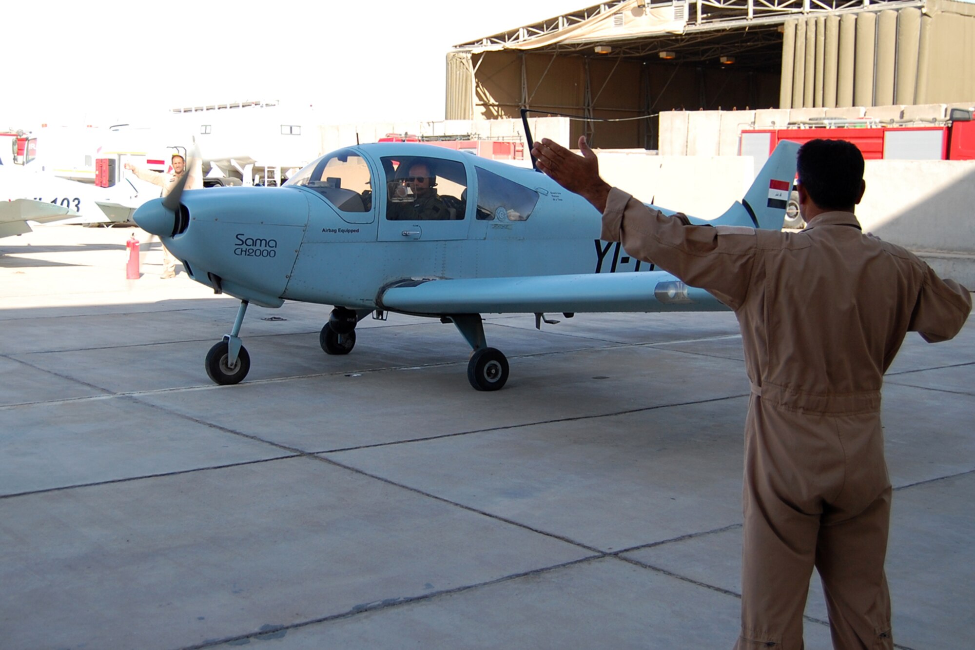 Iraqi Brig. Gen. Sami Saeed, Basra Air Base commander, gives a thumbs-up from inside a 70th Squadron CH 2000 reconnaissance airplane at Contingency Operating Base Basra, Iraq, June 27, before departing on a joint mission with U.S. forces.  The Electronic Systems Center is completing an Information technology infrastructure project that will significantly improve communication and connectivity for the Iraqi Air Force.   (U.S. Army photo by  Sgt. Benjamin Kibbey, 367th MPAD) 
