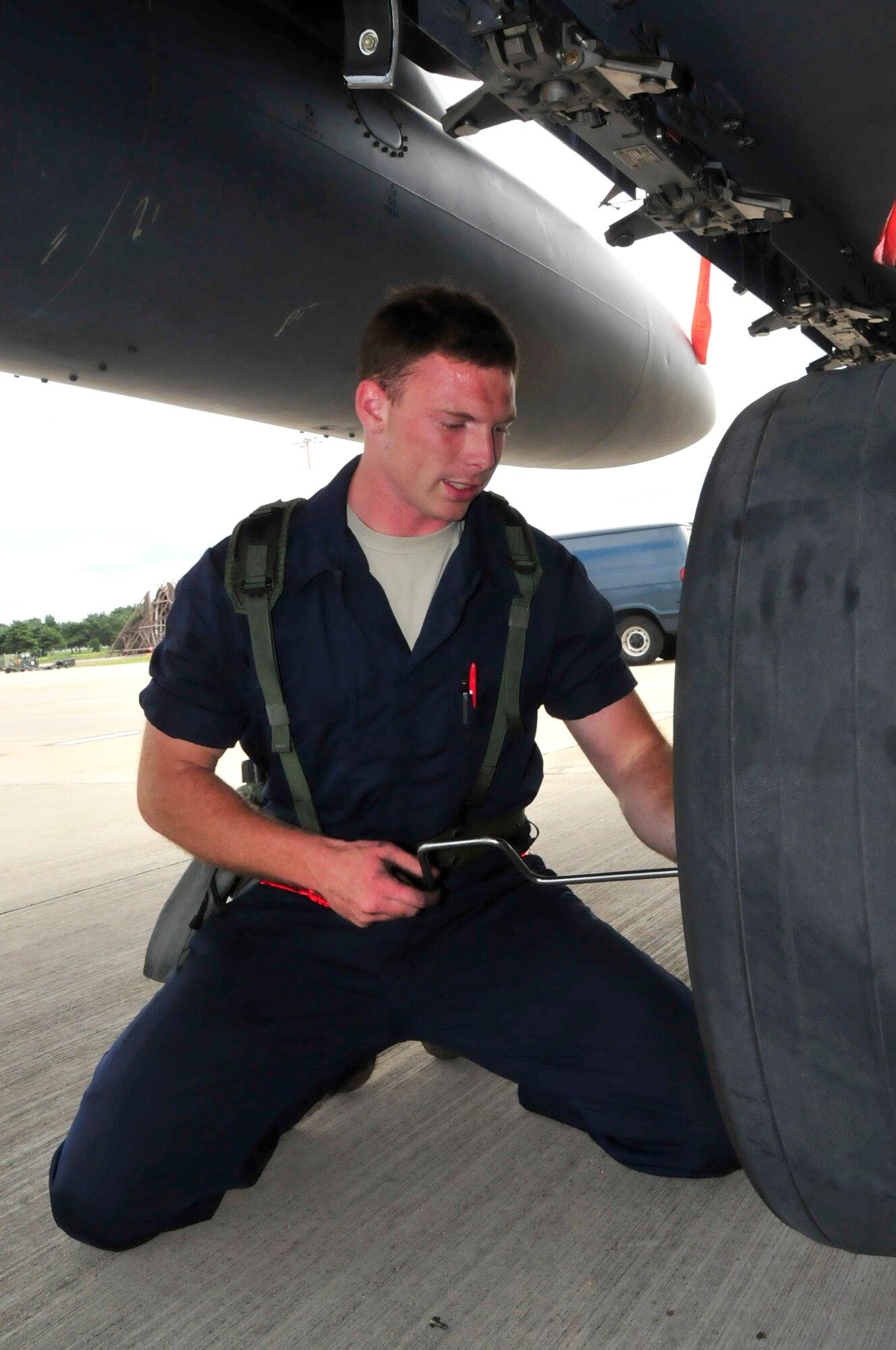 Senior Airman Nathan Spletzer, 494th Aircraft Maintenance Unit crew chief, changes a tire on an F-15 during an operational readiness exercise at RAF Lakenheath, England, Aug. 11. The ORE ensures base-wide combat readiness. (U.S. Air Force photo/Airman 1st Class Eboni Knox)