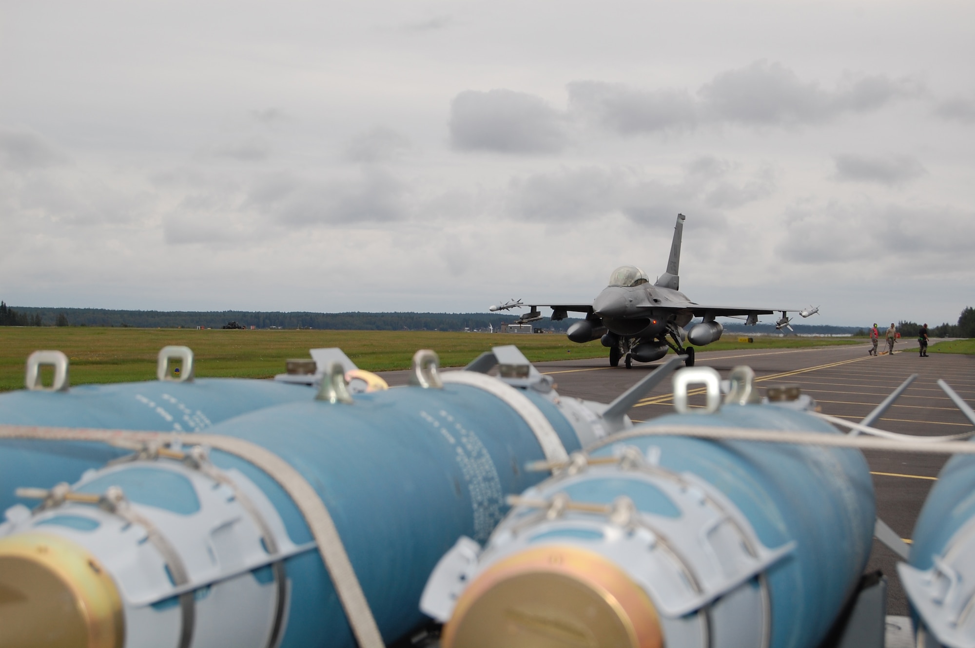 A 555th Fighter Squadron F-16 taxies past some practice munitons on the Kallax Air Base, Sweden, flightline Aug. 5, 2010. About 250 Airmen assigned to the 555th FS and 31st Aircraft Maintenance Squadron returned home to Aviano Air Base, Italy, Aug. 13, 2010 after spending two weeks in Sweden conducting air-to-air and air-to-ground training missions at Kallax AB and the nearby Vidsel Test Range. (U.S. Air Force photo by Tech. Sgt. Lindsey Maurice/Released) 