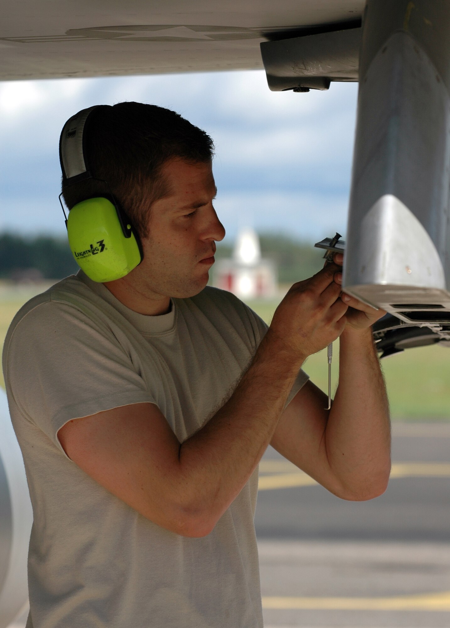 Staff Sgt. John Tuscher, 31st Aircraft Maintenance Squadron weapons load crew member, prepares for a practice munitions load onto an F-16 Aug. 6, 2010 at Kallax Air Base, Sweden. The 555th Fighter Squadron and 31st AMXS conducted more than 180 air-to-air and air-to-ground missions during a two week exercise at the air base in which they worked alongside the Swedish air force's Norrbotten Wing. (U.S. Air Force photo by Tech. Sgt. Lindsey Maurice/Released)