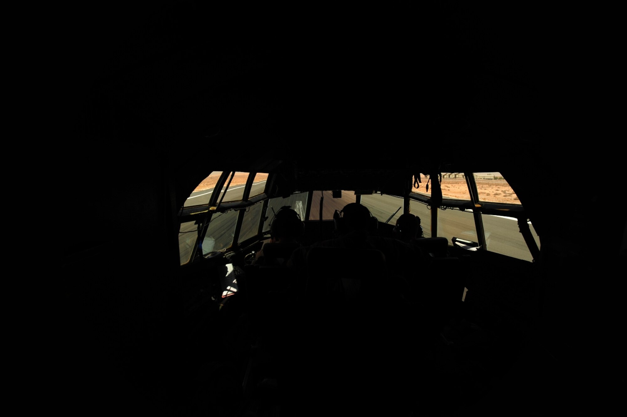 U.S. Air Force Capt. David Miller a C-130 Hercules pilot assigned to the 777th Expeditionary Airlift Squadron, races down the runway during take-off in support of Iraqi Freedom at Joint Base Balad, Iraq on July 25, 2010. (U.S. photo by Staff Sgt. Andy M. Kin / Released)