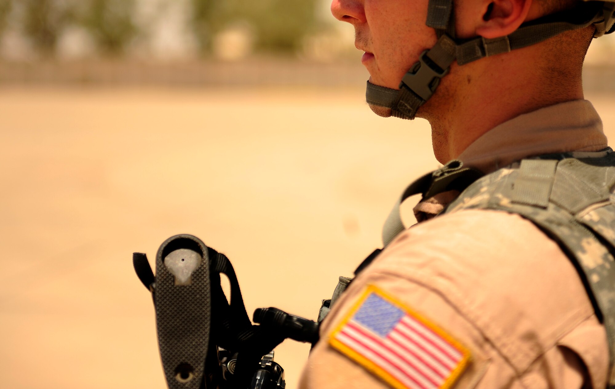 U.S. Air Force Airman First Class Austin Forsythe a security forces Fast Action Response Team(FAST) member assigned to the 532nd Expeditionary Security Forces Squadron, scans his sector of patrol during an equipment off load aboard a C-130 Hercules aircraft assigned to the 777th Expeditionary Airlift Squadron, during flying mission at Joint Base Balad, Iraq on July 25, 2010. 
(U.S. Air Force photo by Staff Sgt. Andy M. Kin / Released)