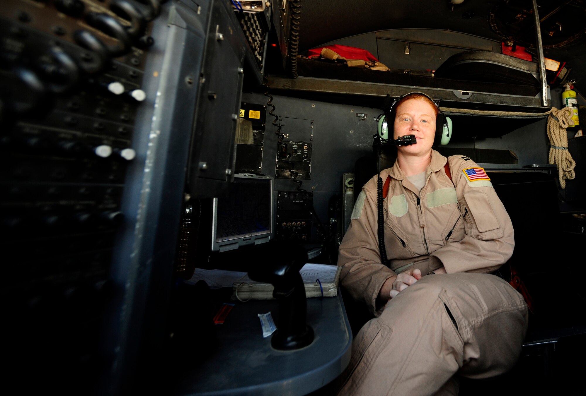 U.S. Air Force Capt. Elizabeth Valasek a C-130 Hercules navigator assigned to the 777th Expeditionary Airlift Squadron, looks out to the horizon during a flying mission over Iraq generating out of Joint Base Balad, Iraq on July 25, 2010. 
(U.S. Air Force photo by Staff Sgt. Andy M. Kin / Released)