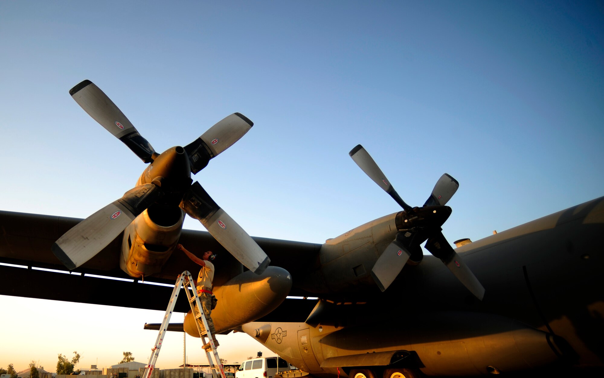 U.S. Air Force maintenance technician assigned to the 777th Expeditionary Aircraft Maintenance Squadron, overlooks engines during pre-flight inspections on a C-130 Hercules aircraft prior to departure at Joint Base Balad, Iraq on July 25, 2010. 
(U.S. Air Force photo by Staff Sgt. Andy M. Kin / Released)