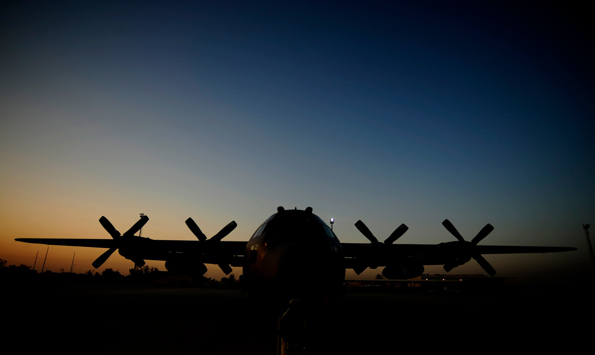 U.S. Air Force C-130 Hercules aircraft assigned to the 777th Expeditionary Airlift Squadron, sits on the flightline during sunrise prior to flying mission at Joint Base Balad, Iraq on July 25, 2010. 
(U.S. Air Force photo by Staff Sgt. Andy M. Kin / Released)