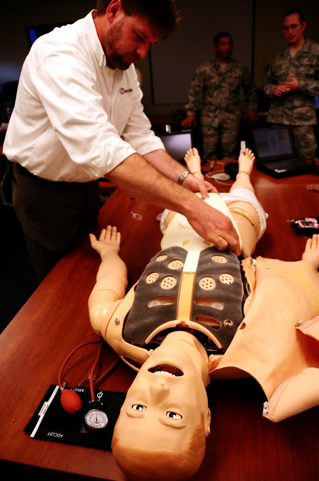 ANDERSEN AIR FORCE BASE, Guam – Daniel Beelitz, Simulation and Military Specialist for a major medical equipment manufacturer, demonstrates the capabilities of a SimMan 3G mannequin Aug. 5, at the Commando Warrior Regional Training Center. SimMan 3G, a realistic human patient simulator created by a major medical equipment manufacturer,  is designed to provide a more hands on training experience for emergency responders and medics. The 736th Security Forces Squadron’s Commando Warrior Pacific Air Forces Regional Training Center now possesses two. (U.S. Air Force photo by Airman 1st Class Anthony  Jennings)
