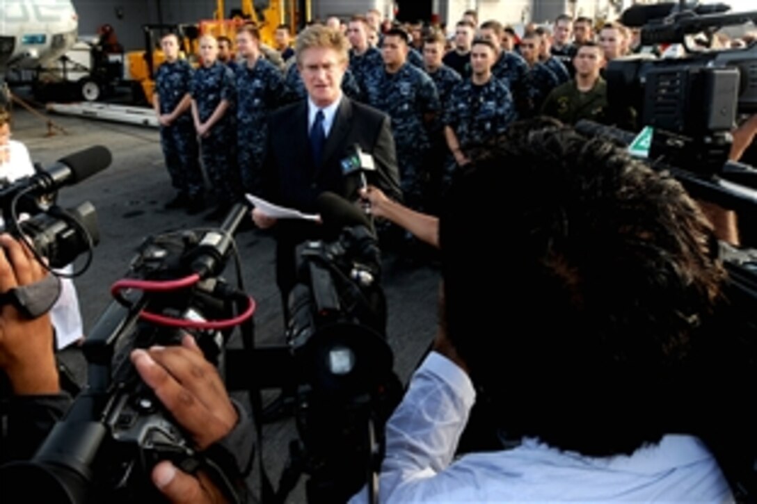 William J. Martin, center, U.S. consul general in Karachi, Pakistan, speaks to Pakistani media during a visit to the USS Peleliu in the North Arabian Sea, Aug. 12, 2010. Martin was on board to meet with the U.S. Navy and Marine Corps leaders responsible for delivering relief supplies to flood-stricken areas of Pakistan.