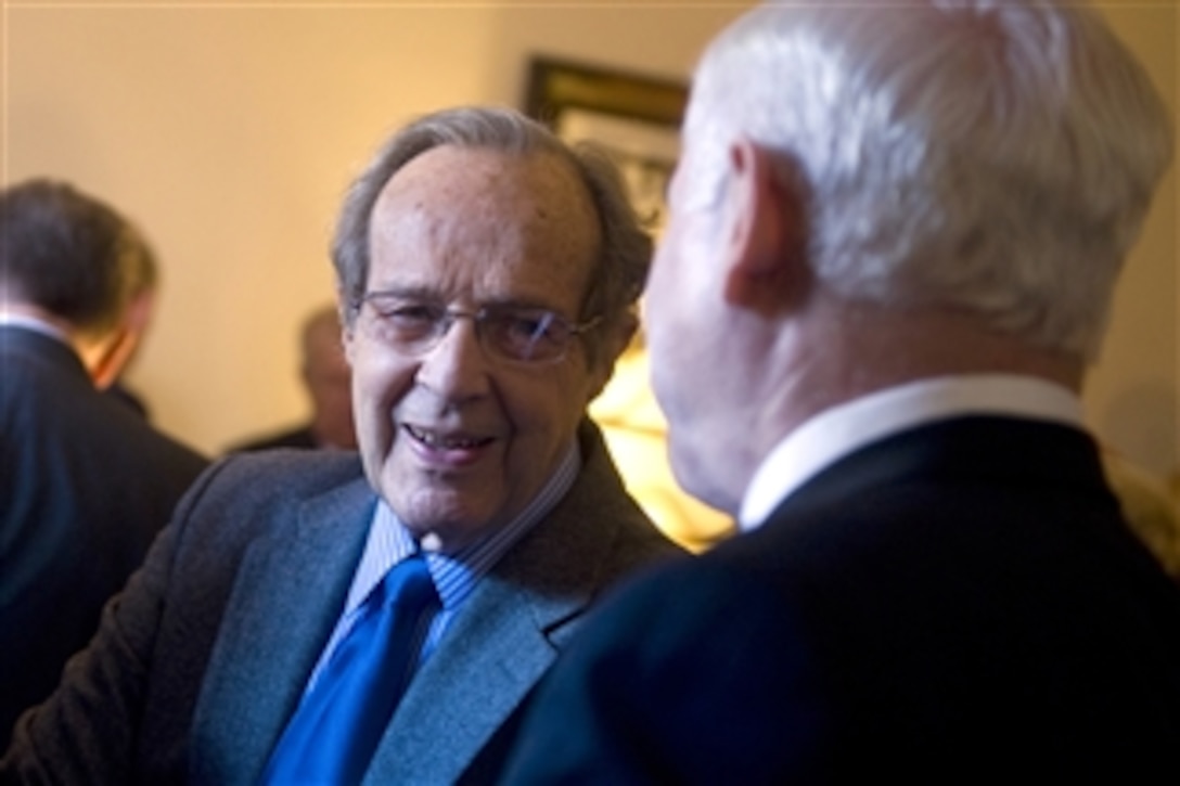 Former Secretary of Defense William Perry speaks with Secretary of Defense Robert M. Gates during a reception prior to the George P. Schultz lecture to the Marines' Memorial Association in San Francisco, Calif., on Aug. 12, 2010.  