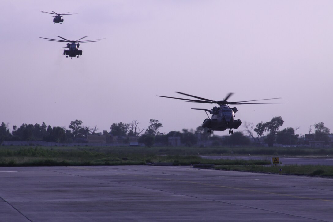 U.S. Marine Super Stallions (CH-53E) helicopters from HMM-165 REIN, 15th Marine Expeditionary Unit land at Ghazi Air Base, Pakistan as a part of the humanitarian assistance relief efforts in Pakistan, Khyber Pakhtunkhwa province (formerly North West Frontier province), Pakistan, Aug. 13, 2010.