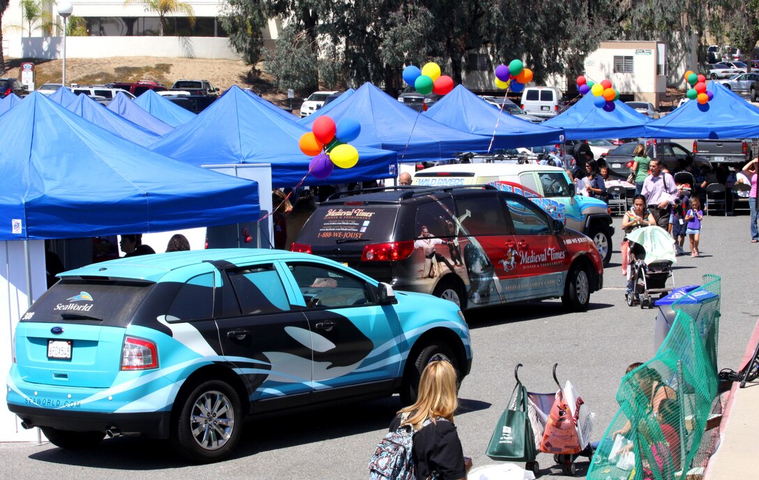 Camp Pendleton residents and visitors are enjoying the annual Information Tickets and Tours Latitudes and Travel Exposition, Aug. 14. The event incorporated more than 50 vendors that distributed information regarding discounts and free admission for local entertainment venues and activities. Patrons enjoyed everything from a paintball tent with human-shaped targets, to a mascot of the Sea World star Shamu, who charmed young children and posed for photos.
