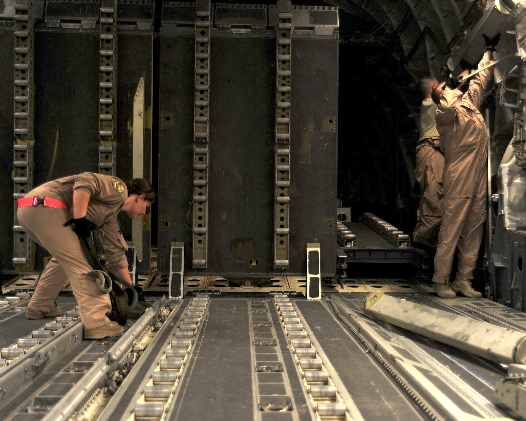 Crew members for a C-17 flight prepare for takeoff at an undisclosed location in Southwest Asia August 9. (U.S. Air Force photo/Senior Airman Katie Gieratz)
