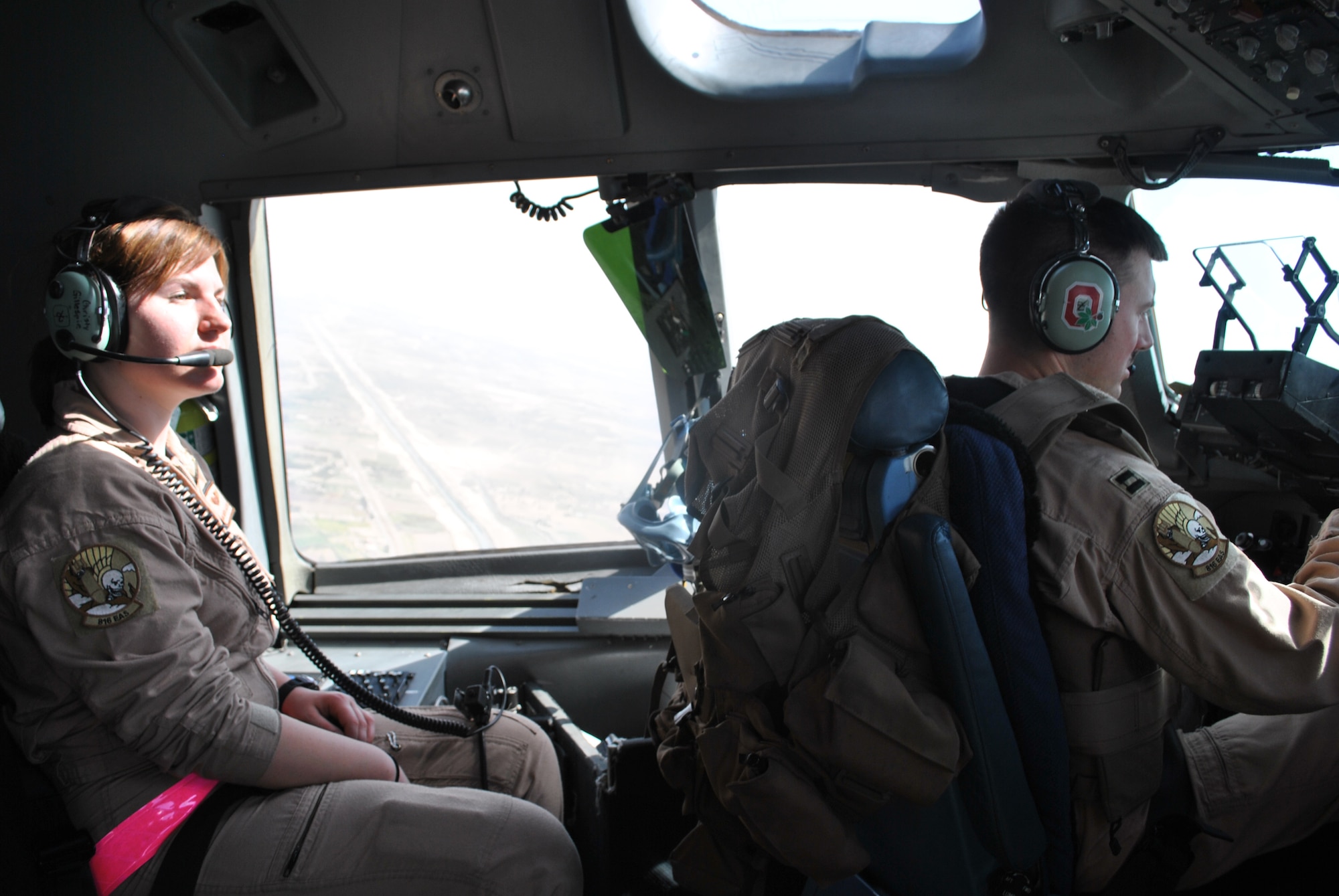 Airman Christina Gillespie, 816th Expeditionary Airlift Squadron loadmaster,
watches the skies during a C-17 flight take off August 9. As a loadmaster, she
assists pilots in whatever they need to get off the ground. (U.S. Air Force photo/Staff Sgt. Nika Glover)