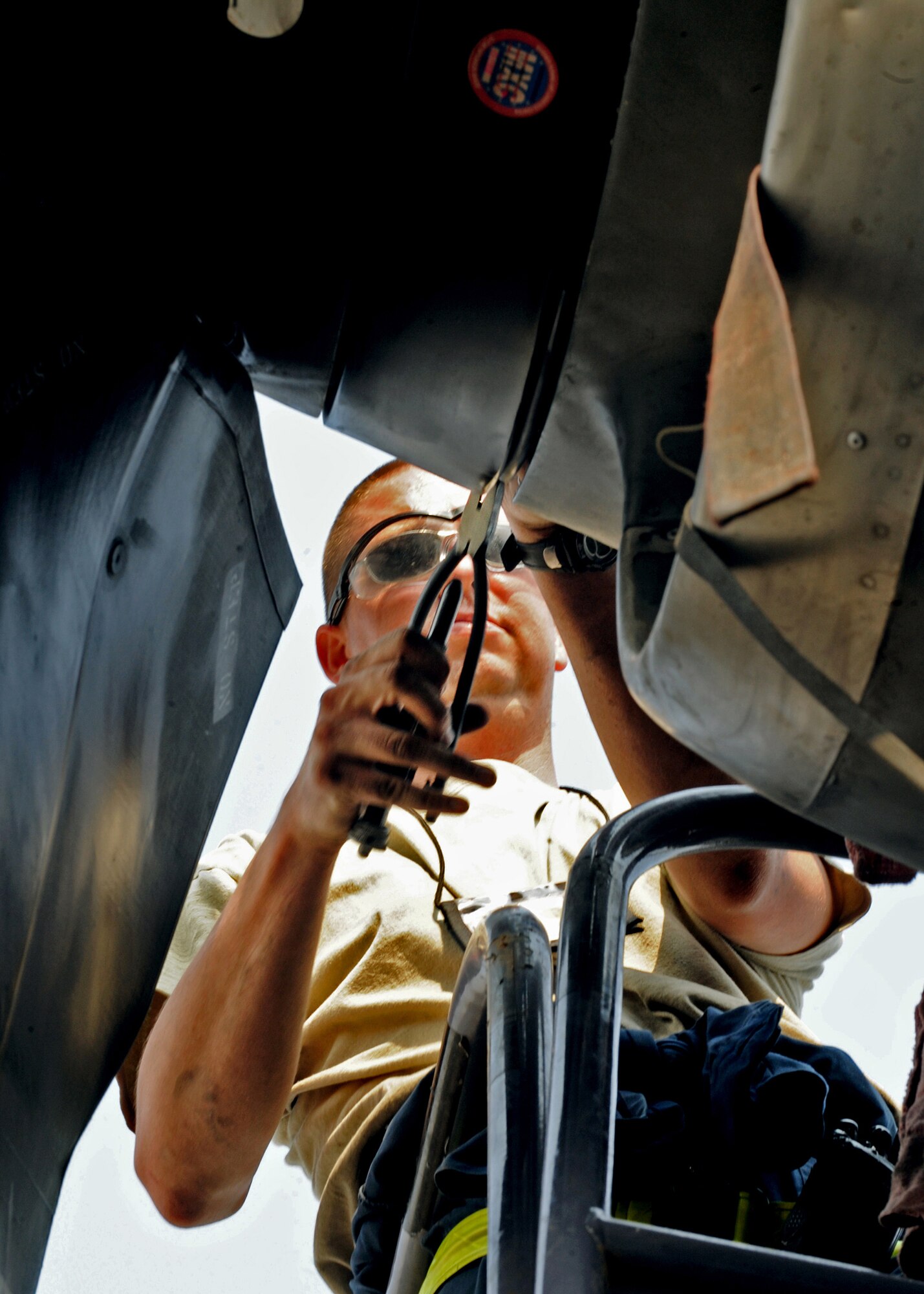 SOUTHWEST ASIA - Tech. Sgt. Christopher Chadwell, a propulsion craftsman with the 386th Expeditionary Aircraft Maintenance Squadron, secures the filler cap to a pressurized sump after a hydraulic fluid level check on a C-130E Hercules at an undisclosed location here August 11, 2010. The 386 EAMXS is one of the busiest C-130 combat airlift and EC-130 electronic attack maintenance units in U.S. Air Forces Central Command. (U.S. Air Force photo by Senior Airman Laura Turner)