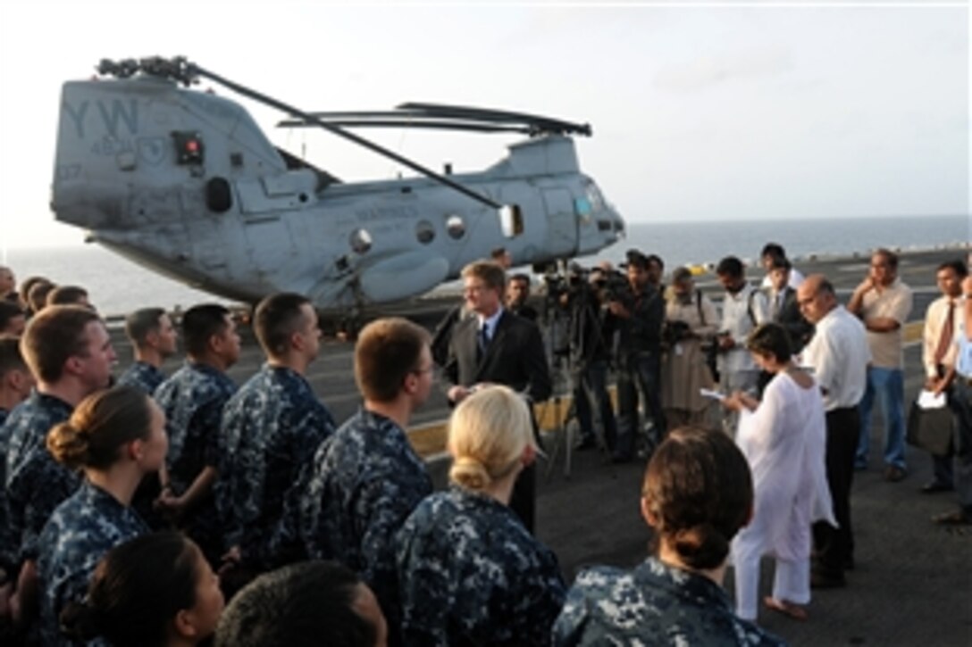William J. Martin, center, consul general at the U.S. Consulate in Karachi, Pakistan, addresses U.S. sailors and Marines during a visit to the USS Peleliu, off the coast of Pakistan, Aug. 12, 2010. Martin met with sailors and Marines who will be delivering relief supplies to flood-stricken areas of Pakistan. 