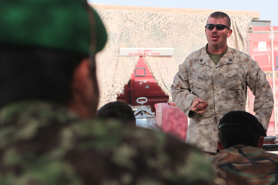 Sgt. Jeffrey A. Whalen, a counter-improvised explosive device course instructor with 3rd Combat Engineer Battalion, teaches Afghan National Army soldiers about commonly found explosives during the Counter-IED Course held at the Joint Security Academy Southwest at Camp Leatherneck, Afghanistan, Aug. 15.::r::::n::