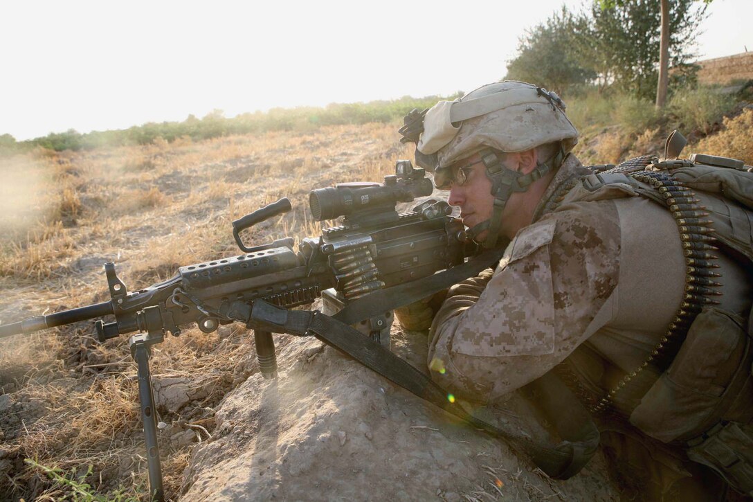 Lance Cpl. Joshua L. Hamilton, a squad automatic gunner with Echo Company, 2nd Battalion, 6th Marine Regiment, provides security during a patrol through Marjah, Afghanistan, Aug. 15, 2010. Hamilton, 25, is from Carthage, N.Y.