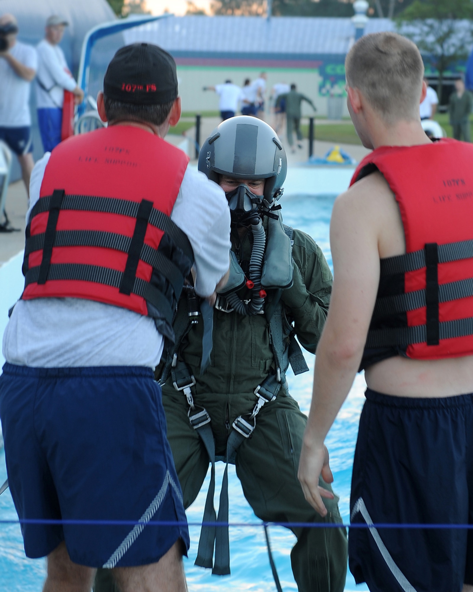 Lt. Col. William Henderson, chief of safety and an A10 pilot for the 127th Wing, is pulled into the water as part of his water survival refresher training, Aug. 15, 2010. During the training, pilots from Selfridge Air National Guard Base were pulled into the wave pool at Red Oaks Water Park in Madison Heights, Mich., to simulate the pull of a parachute. The pilots then had to extricate themselves from the parachute harness. The pilots are required to undergo the water survival training once every three years. (U.S. Air Force photo by TSgt. Dan Heaton) (RELEASED)