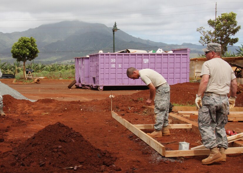Members of the 131st Civil Engineering Squadron set up a perimeter for concrete to be poured, June 15. This will be used to build a restroom at the Helemano Plantation Amphitheatre, Wahiawa, Hawaii. (Photo by Tech Sgt. Virginia Todd)