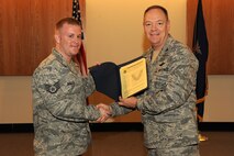 Colonel Kevin W. Bradley, 174th Fighter Wing Commander presides over the NCO/SrNCO Induction ceremony during the August 2010 UTA at Hancock Field. 
(US Air Force Photo by: Staff Sgt James N. Faso II/ Released) 
