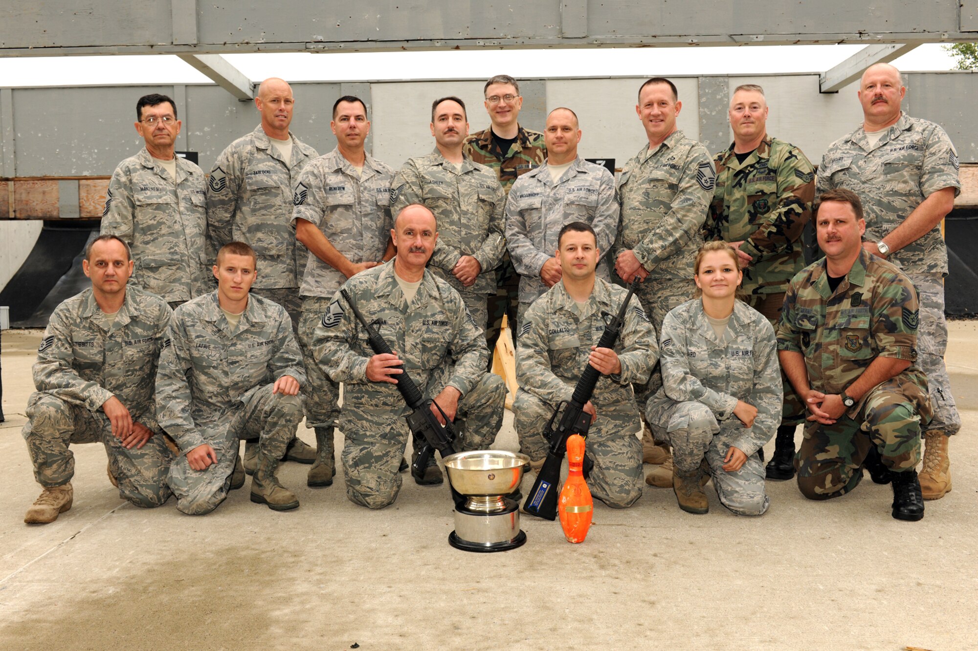 174th Rifle Team members pose with: Master Sgt. Paul Cowan, Technical Sgt. Christopher Ashley, Senior Airman Tonya Ward and Senior Airman Andrew LaFave Pose with Awards they earned as a team participating in the Annual TAG match held at Camp Smith Peekskill New York. The four person team earned the overall Team Rifle Champion Cup. (US Air Force photo by Staff Sgt. James N. Faso II/Released)