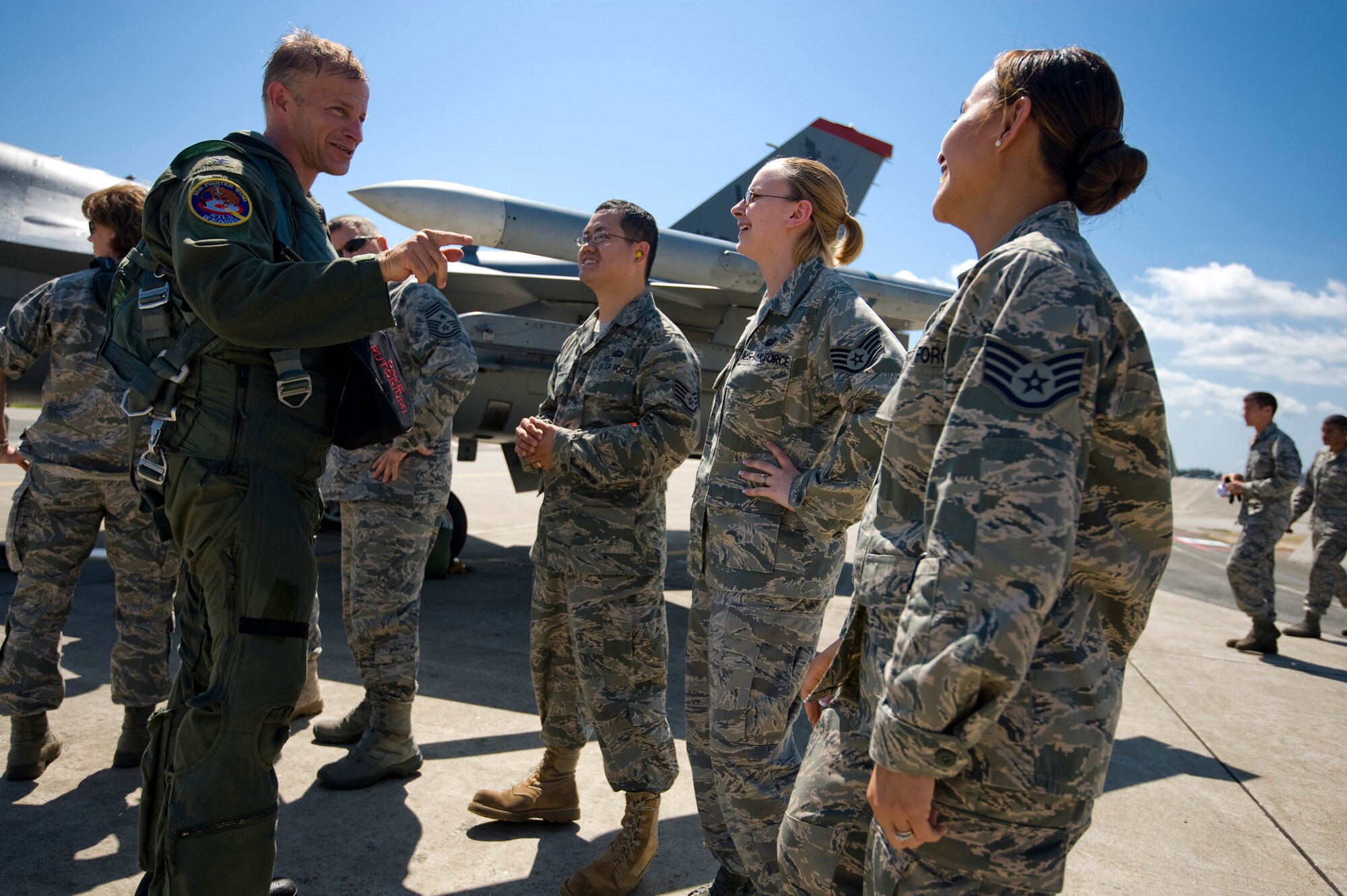 MISAWA AIR BASE, Japan -- Col. RC Craig, 35th Fighter Wing Commander, left, jokes with members of the 35th Fighter Wing knowledge operations office at the flightline, here, Aug. 13. This was Colonel Craig's final flight at Misawa. (U.S. Air Force photo/Staff Sgt. Samuel Morse)