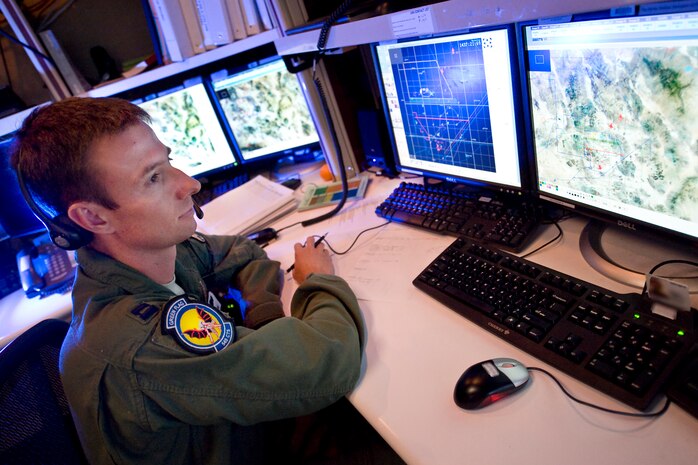 NELLIS AIR FORCE BASE, Nev.-- Capt. Andy Labrum, close air support instructor, 549th Combat Training Squadron observes aircraft movement and communications between joint terminal attack controllers and pilots during Green Flag West 10-9 exercise held at the National Training Center in Fort Irwin, Calif.  Green Flag-West provides a realistic air-land integration training environment for joint forces preparing to support worldwide combat operations. (U.S. Air Force Photo by Lawrence Crespo)

