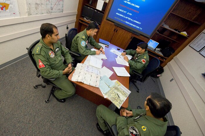 NELLIS AIR FORCE BASE, Nev.-- Wing Commander Hatmi of the Pakistan Air Force briefs fellow crew members prior to participating in the Green Flag West 10-9 exercise at Nellis Aug. 11. The U.S. Air Force is hosting the Pakistan and Royal Saudi Air Force's pilots and support personnel during Green Flag-West Aug. 9-20 at Nellis Air Force Base, Nev.  Green Flag-West provides a realistic air-land integration training environment for joint forces preparing to support worldwide combat operations. (U.S. Air Force Photo by Lawrence Crespo)


