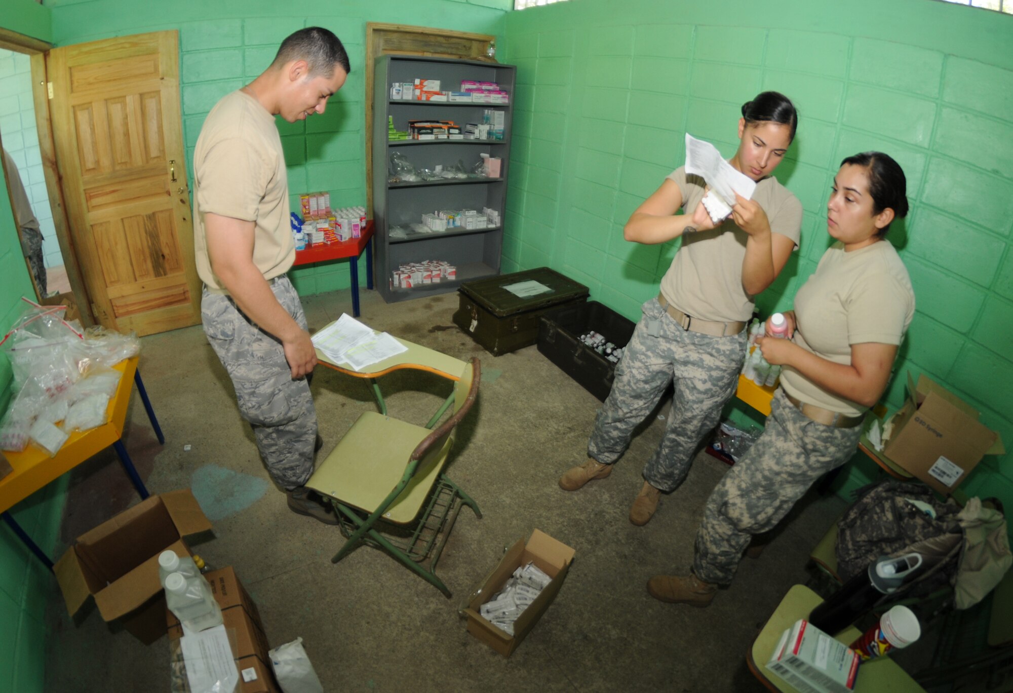 YAPUWAS, Honduras --  Capt. Javier Rodriguez, Staff Sgt. Michelle Benford and Spc. Nicole Ney, all with Joint Task Force-Bravo, help fill prescriptions during the medical civic action program here Aug. 11. Personnel from JTF-Bravo assisted the Honduran Ministry of Health, military and civilian medical professionals in providing care to more than 1,800 people in remote villages in the La Moskitia province. (U.S. Air Force photo/Tech. Sgt. Benjamin Rojek)