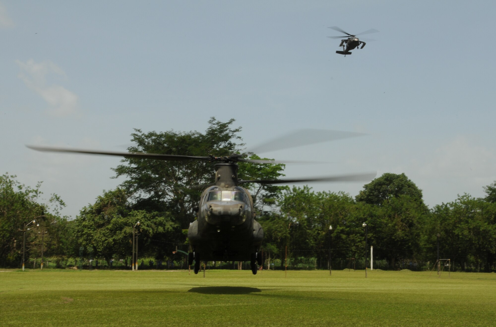 CATACAMAS, Honduras --  Helicopters from the 1-228th Aviation Regiment land at the National University of Agriculture here Aug. 9 in preparation for the a medical civic action program in the La Moskitia province. 1-228th pilots flew medical and support personnel into three different villages during the four-day MEDCAP. (U.S. Air Force photo/Tech. Sgt. Benjamin Rojek)