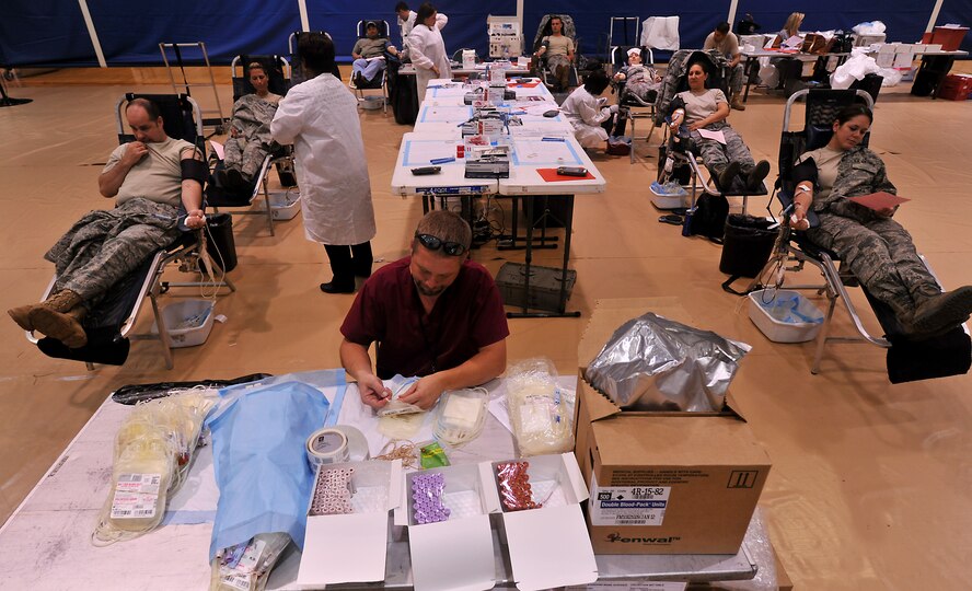 MOODY AIR FORCE BASE, Ga. -- As Moody volunteers make their donations, American Red Cross technicians monitor them and prepare more bags for the next group of donors here Aug. 12. (U.S. Air Force photo by Airman 1st Class Joshua Green/RELEASED)