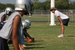 Pete Wesp, the head coach for the Randolph High School football team, prepares his players for the upcoming 2010 season. The Ro-Hawks had a rough 2009 season, but Mr. Wesp said the team has a strong tradition of winning seasons. (U.S. Air Force photo/Brian McGloin)