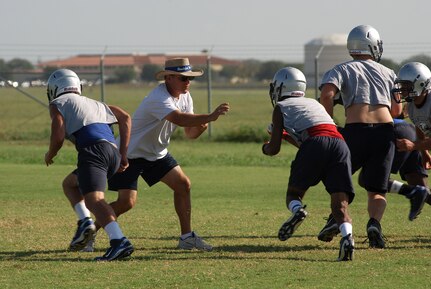 Pete Wesp, the head coach for the Randolph High School football team, prepares his players for the upcoming 2010 season. The Ro-Hawks had a rough 2009 season, but Mr. Wesp said the team has a strong tradition of winning seasons. (U.S. Air Force photo/Brian McGloin)