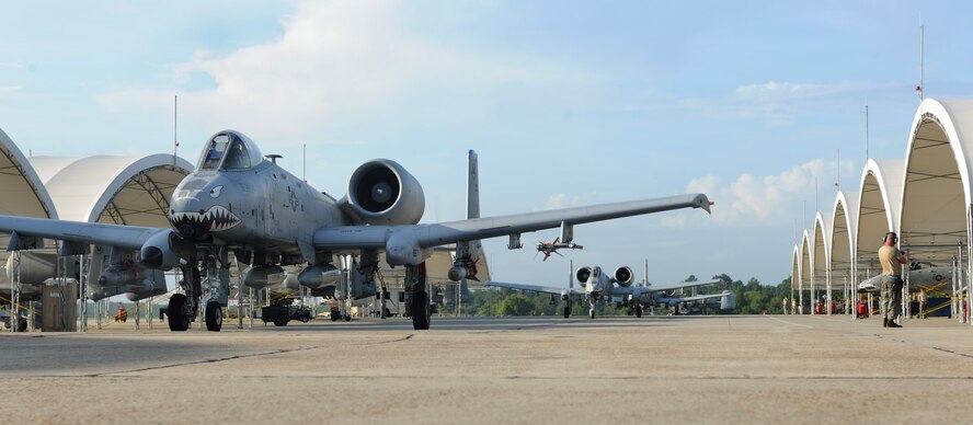 MOODY AIR FORCE BASE, Ga. --Three A-10C Thunderbolt II aircraft taxi onto the runway as they prepare to depart to Yuma, Ariz., Aug. 13. Several Moody A-10C aircraft traveled to Arizona to participate in the Enhanced Mojave Viper Exercise. (U.S. Air Force photo by Airman 1st Class Benjamin Wiseman/RELEASED)