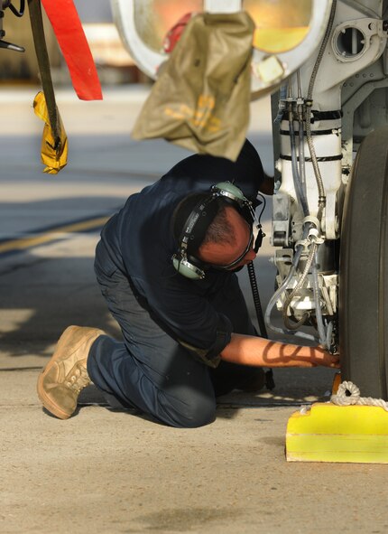 MOODY AIR FORCE BASE, Ga. -- Staff Sgt. David Clifford, Air Combat Command East Coast A-10 Demonstration Team dedicated crew chief, checks the brakes on an A-10C Thunderbolt II before its departure to Arizona in support of the Enhanced Mojave Viper Exercise in Arizona Aug. 13. Each aircraft goes through a pre-flight check list before takeoff. (U.S. Air Force photo by Airman 1st Class Benjamin Wiseman/RELEASED)